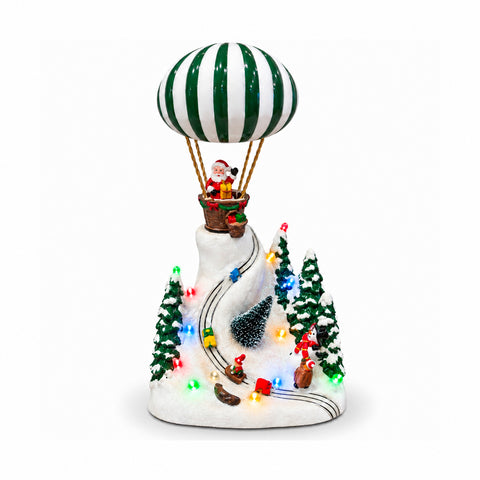 Paysage de Noël avec le père Noël volant, lumières LED et musique