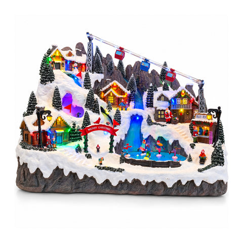 Village de Noël lumineux avec pistes de ski et de patinage en mouvement, lumières LED et musique – 56x37x42 cm