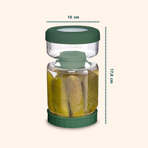 Barattolo per sottaceti con dimensioni tecniche: 10cm larghezza x 17,8cm altezza, capacità 1 litro, design a clessidra con filtro a ribalta